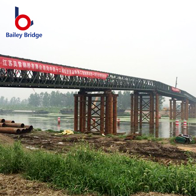 Emergency temporary bridge installation restoring access after severe flooding
